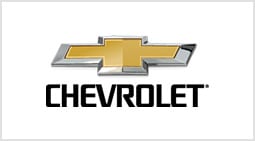 A chevrolet logo is shown on the side of a car.
